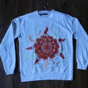 Upcycled White Sweatshirt with Intricate patchwork Sun Design